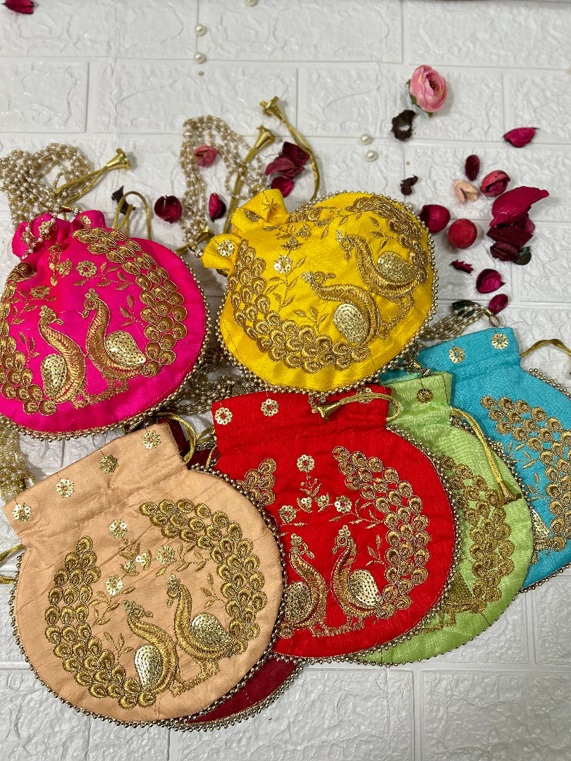 DesiTohfa colorful potli bags with golden peacock embroidery in pink yellow red green blue and beige