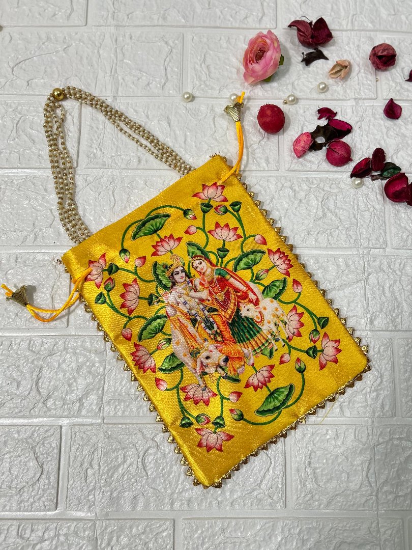 Yellow DesiTohfa potli bag with intricate floral embroidery and traditional couple design
