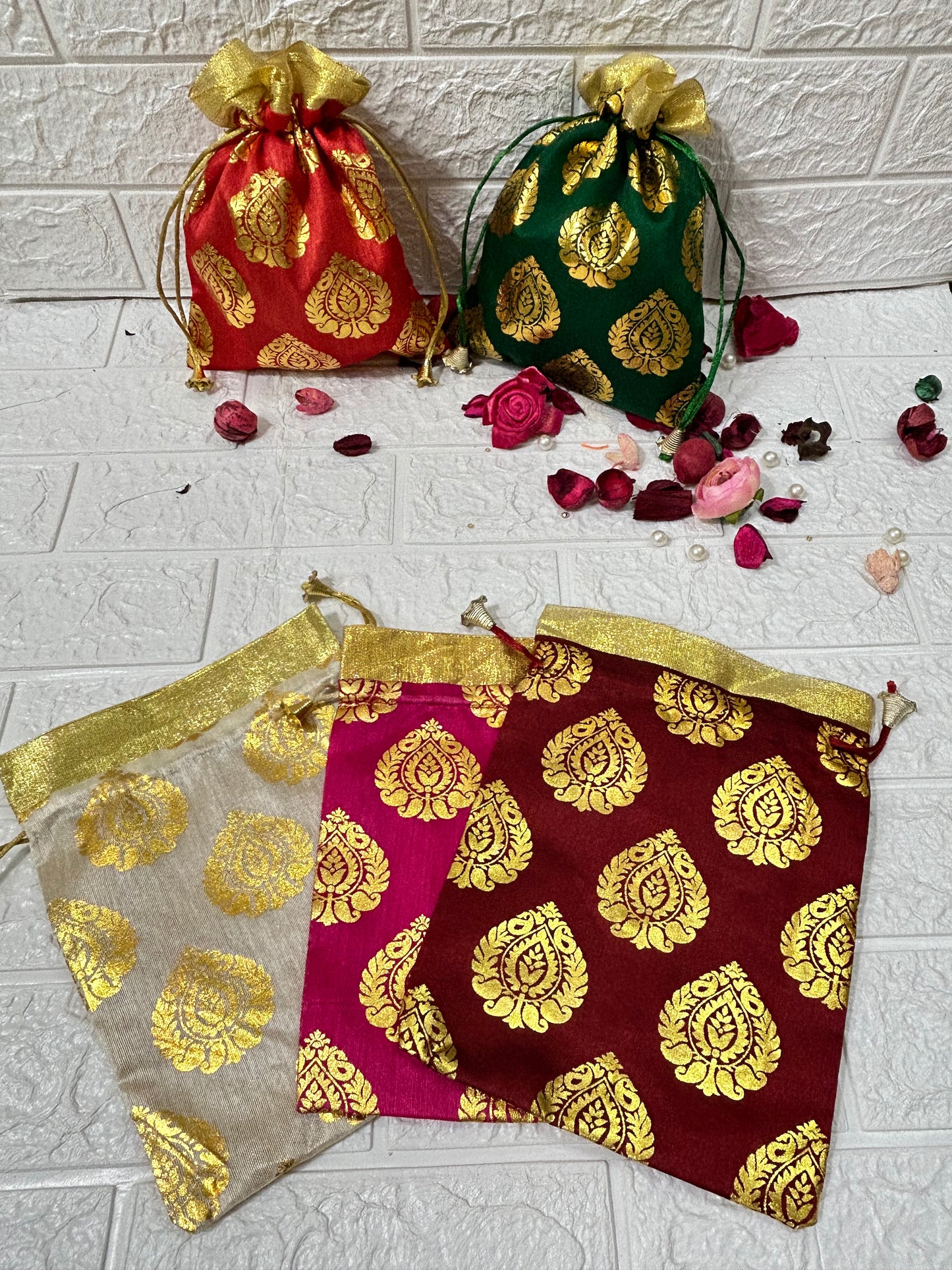 DesiTohfa colorful gift packing potli bags with golden designs for festive and wedding use