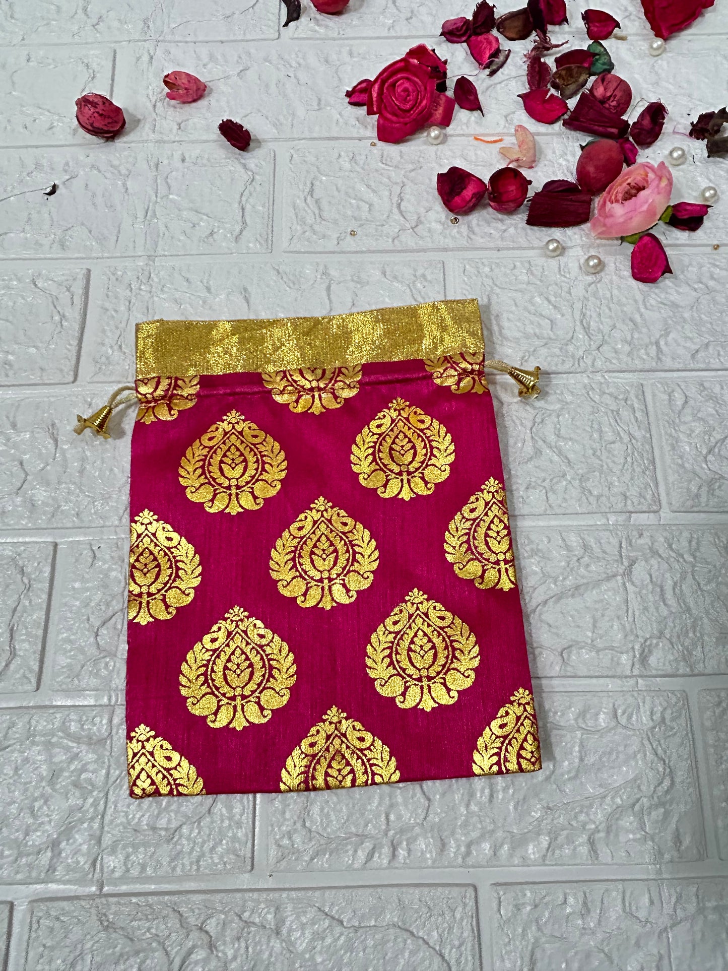 DesiTohfa gift packing potli bags in pink and gold with traditional floral design and drawstring closure