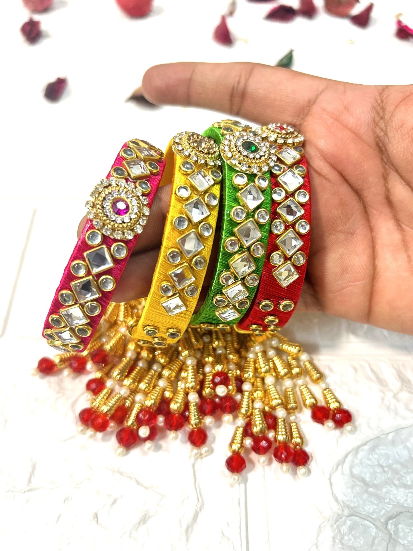 DesiTohfa Kundan Silk Thread Bangles in multicolor with golden bead tassels and intricate mirror work