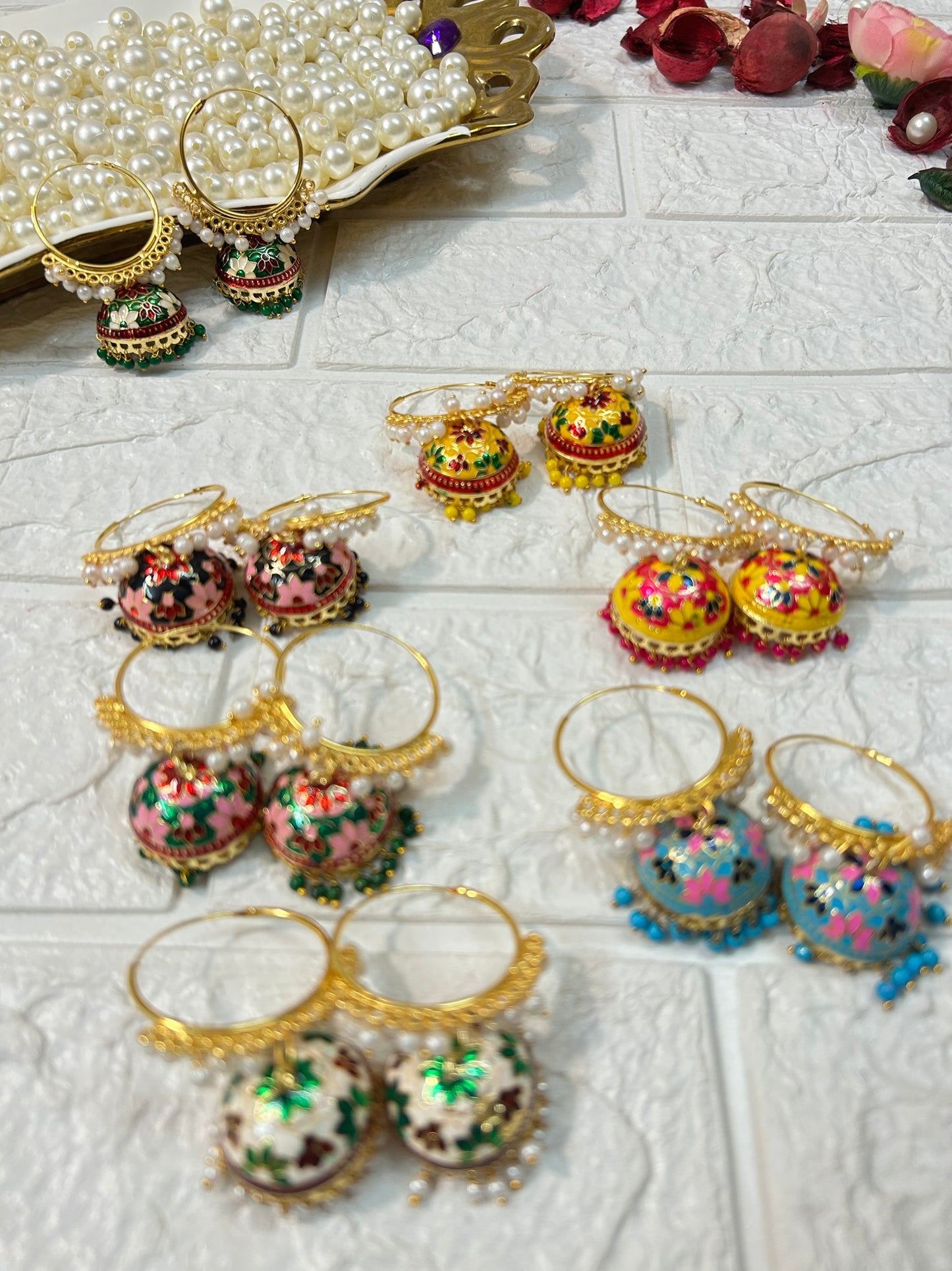 DesiTohfa Meenakari Jhumka earrings in various colors with intricate floral designs and gold detailing
