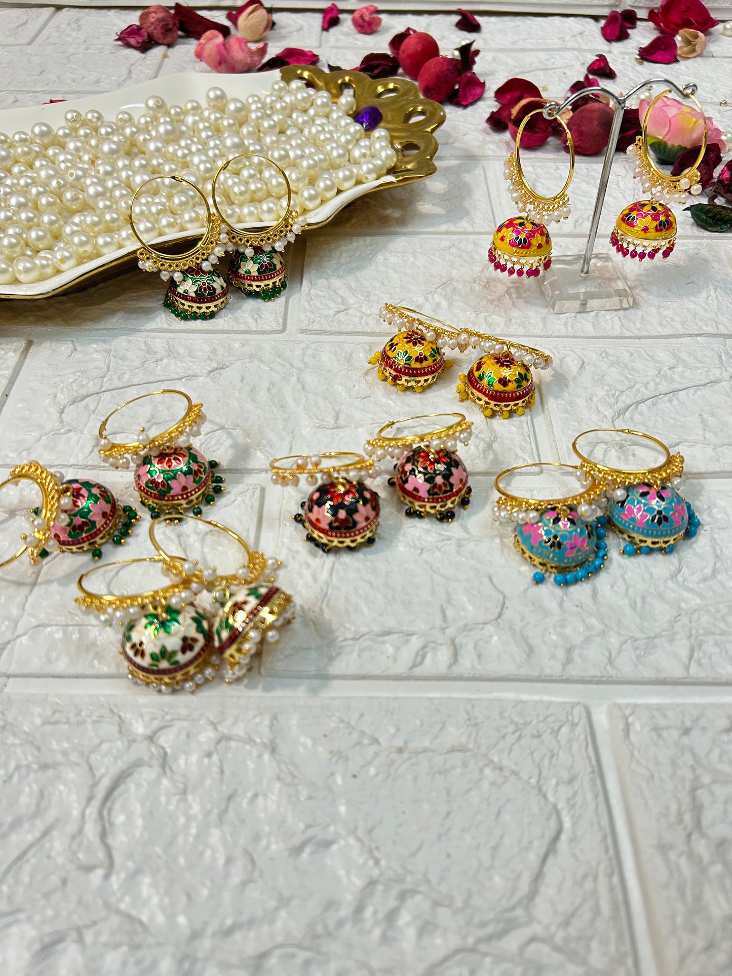 Colorful DesiTohfa Meenakari Jhumka earrings with intricate floral designs and gold-tone hoops