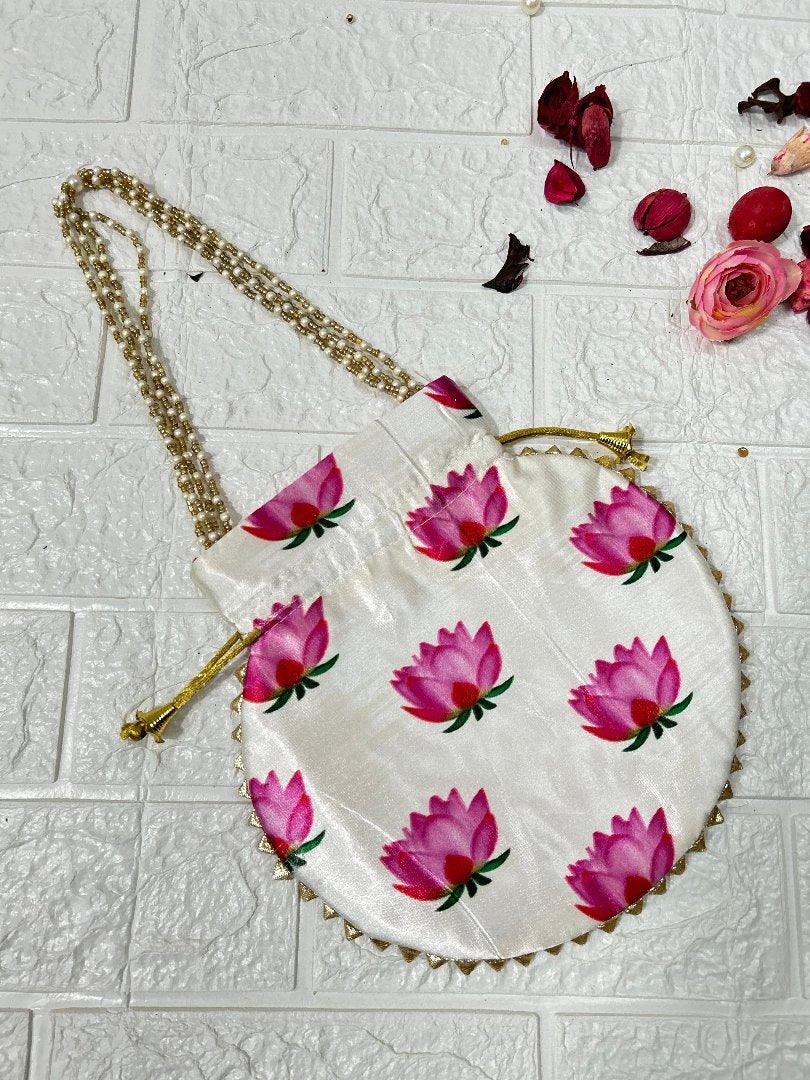 DesiTohfa white round potli bag with pink lotus floral design and gold chain strap
