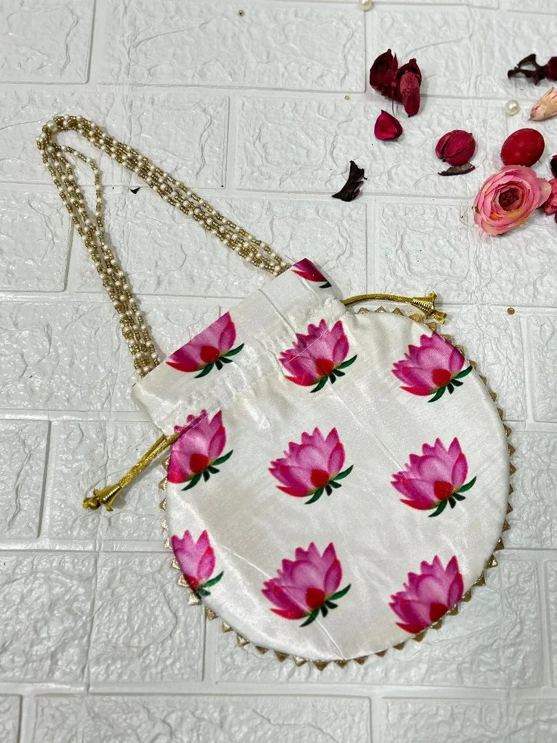 DesiTohfa white potli bag with pink floral design and gold chain strap for traditional occasions