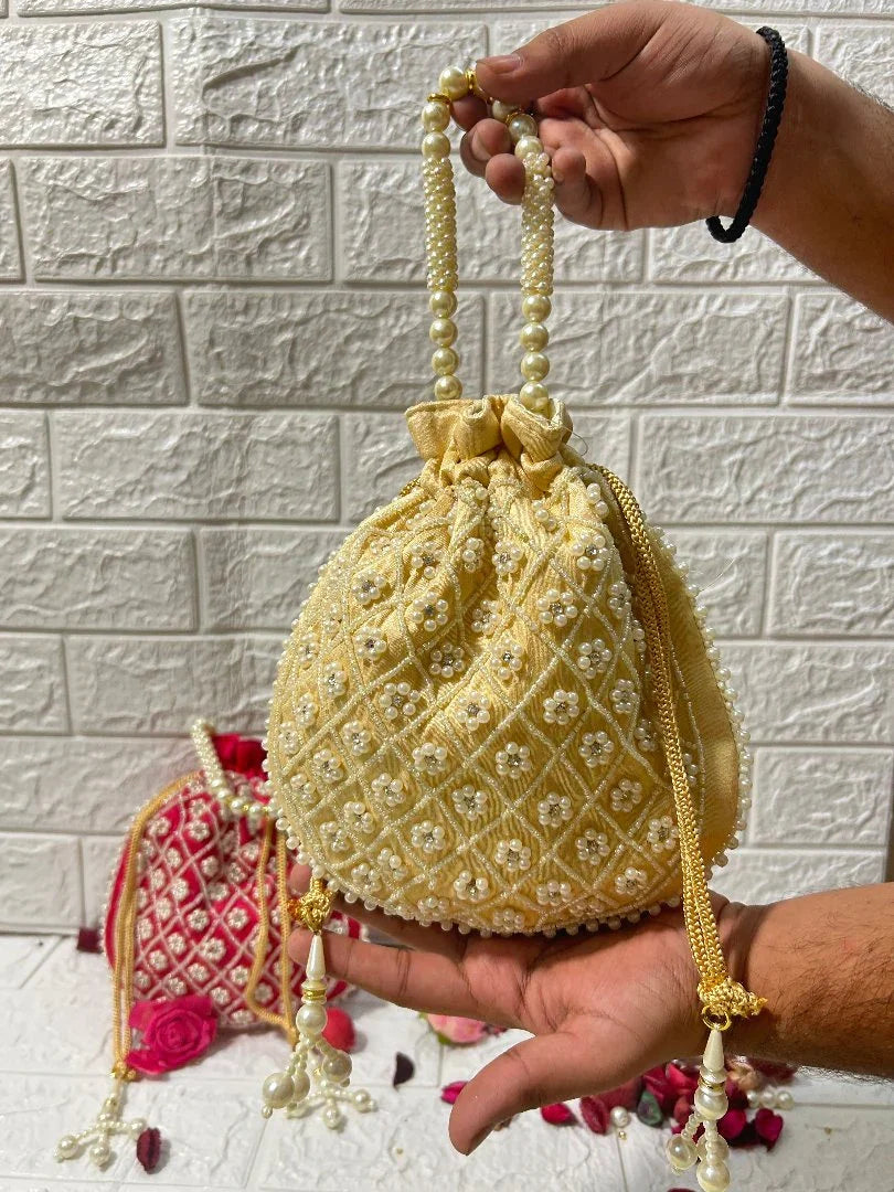 Pearl Work Potli Bags For Bridesmaid Gifts in yellow and red with detailed embroidery and pearl handles