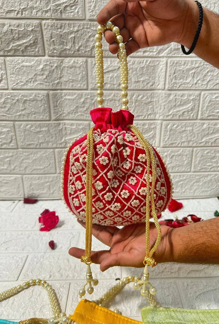 DesiTohfa red Pearl Work Potli Bags For Bridesmaid Gifts with intricate floral embroidery and pearl handle