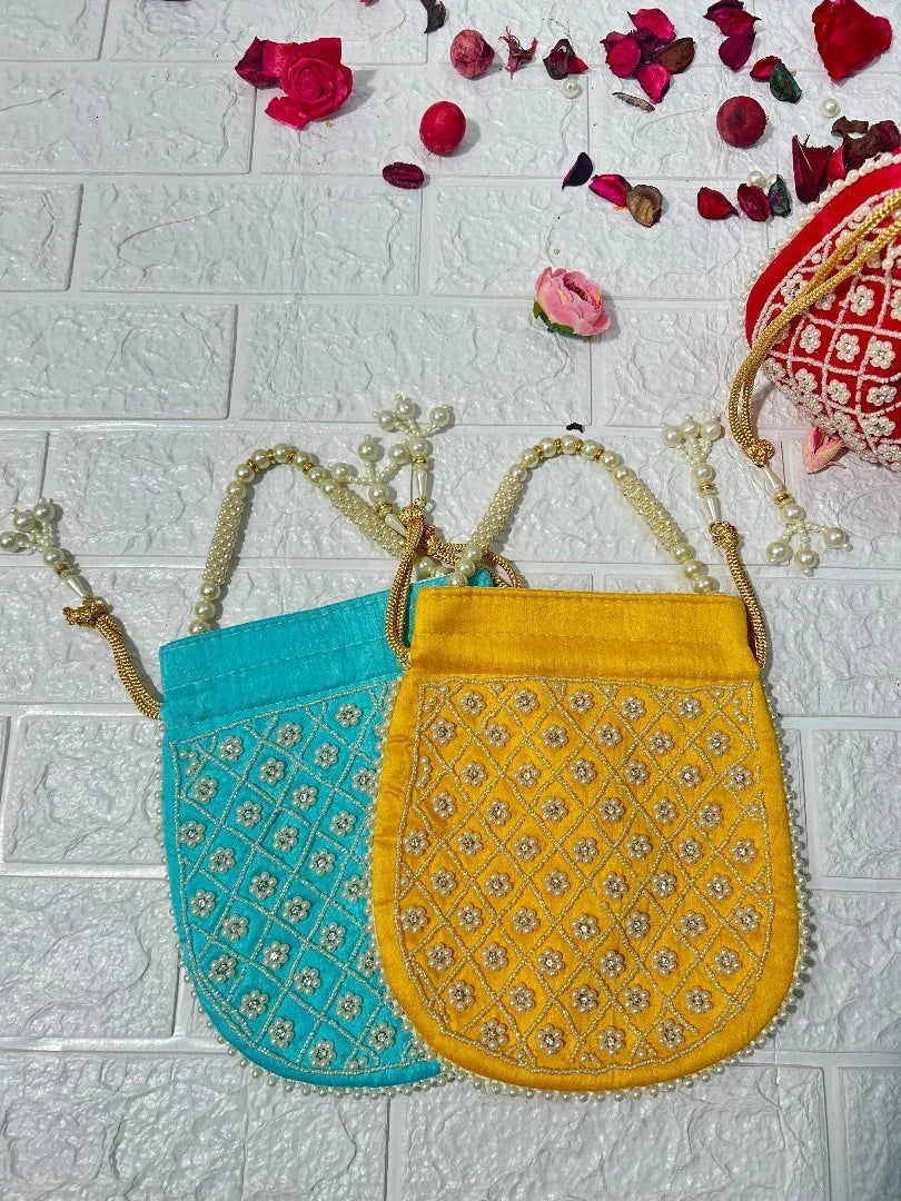 Pearl Work Potli Bags For Bridesmaid Gifts in blue and yellow with intricate embroidery and pearl handles