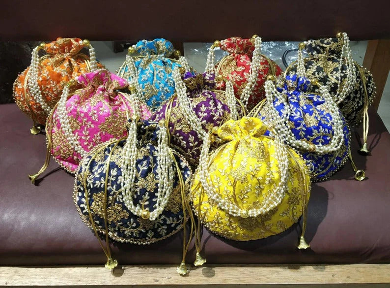 Colorful embroidered potli bags with pearl handles by DesiTohfa perfect for potli-bags-return-gifts