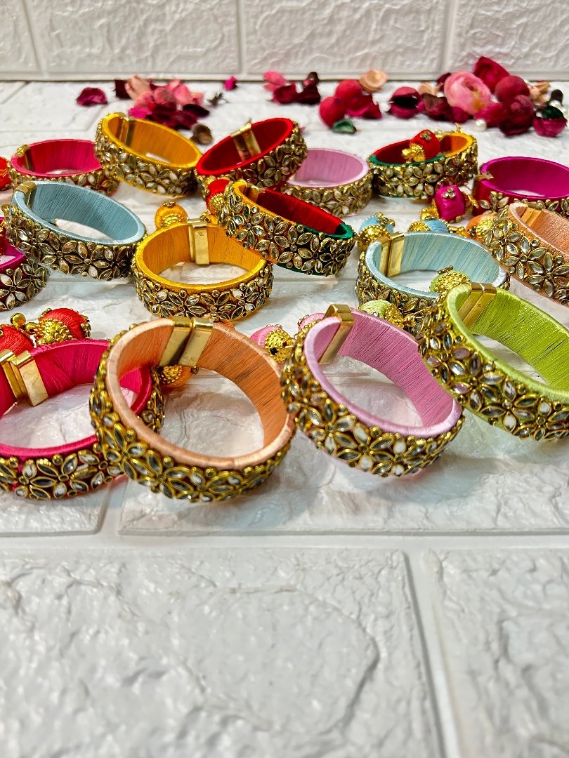 Colorful DesiTohfa Silk Thread openable Bangles with intricate gold detailing and floral designs