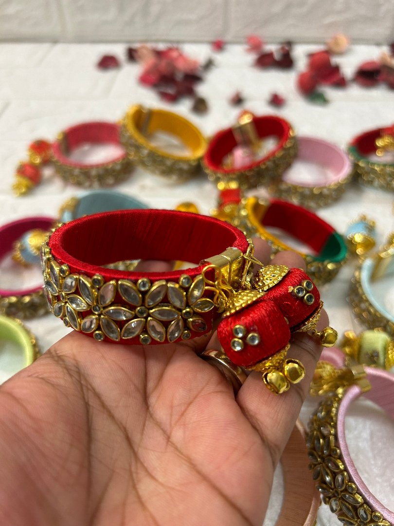 DesiTohfa Silk Thread openable Bangles in red with gold floral design and decorative tassels