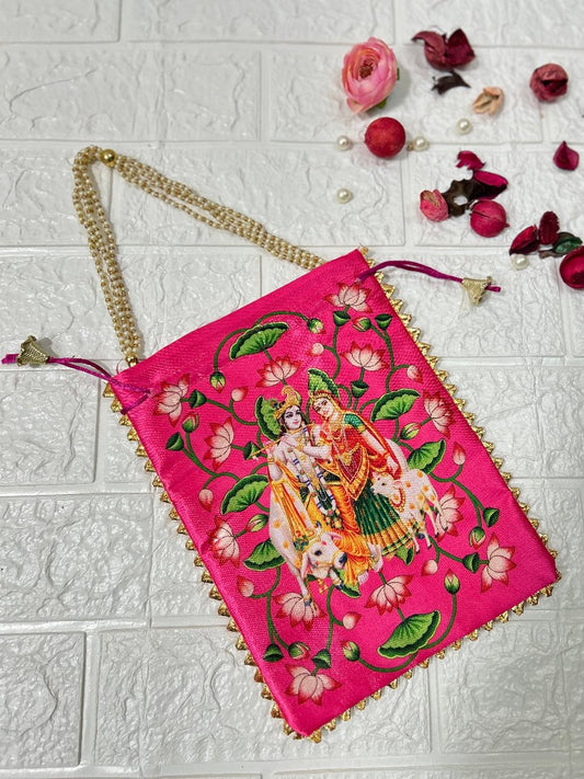 DesiTohfa pink potli bag with traditional Radha Krishna embroidery and golden chain handle