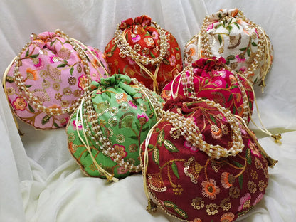 Desi Tohfa 50 Pieces Embroidered Potli Bags in assorted colors with floral designs and decorative strings