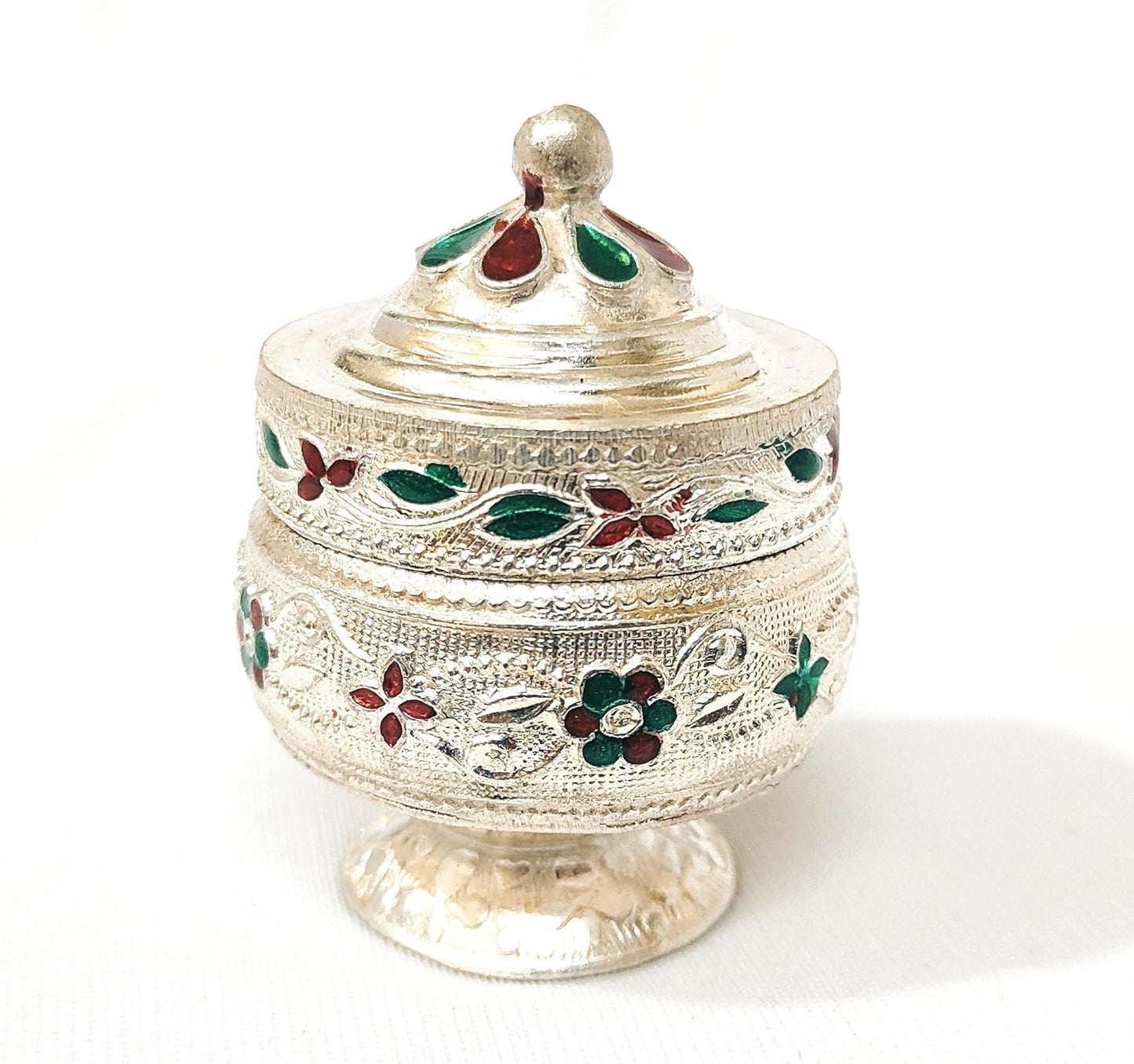 Decorative silver container with floral engravings on a white background