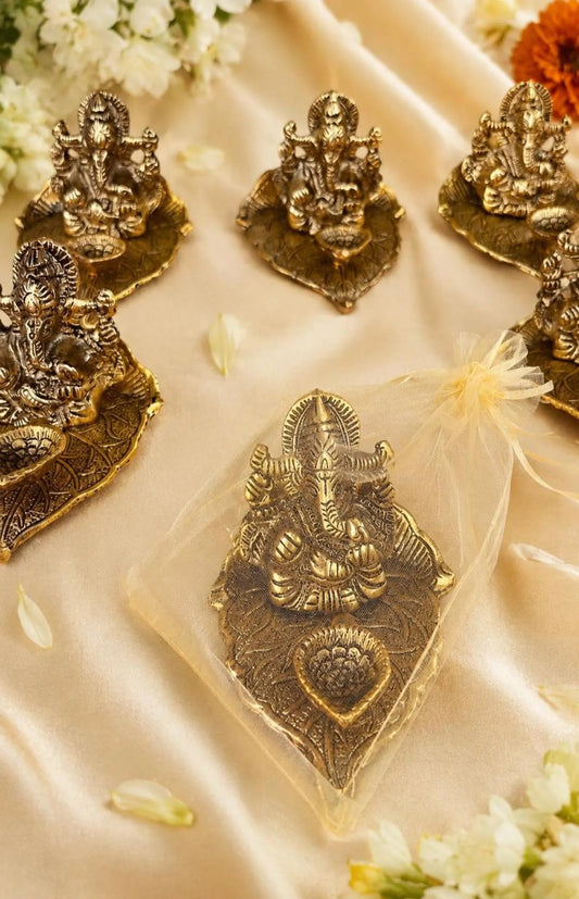 Handcrafted Gold Ganesha on Leaf Stand with Organza Pouch For Return Gifts