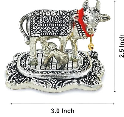 Decorative metal sculpture of a cow and calf with dimensions on a white background
