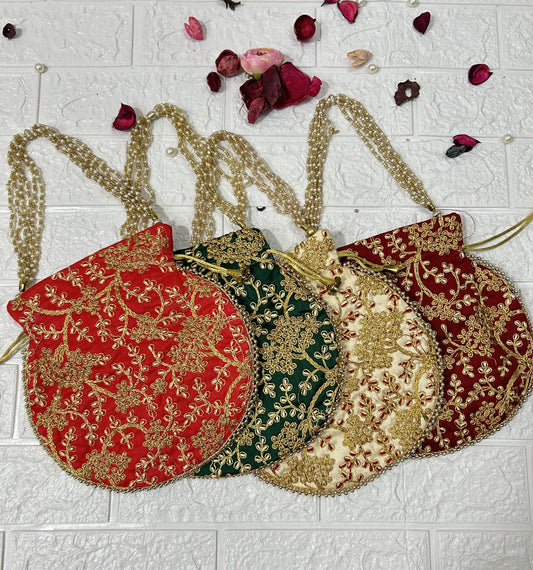 DesiTohfa embroidered potli bags in red, green, cream, and maroon with gold thread work and beaded handles