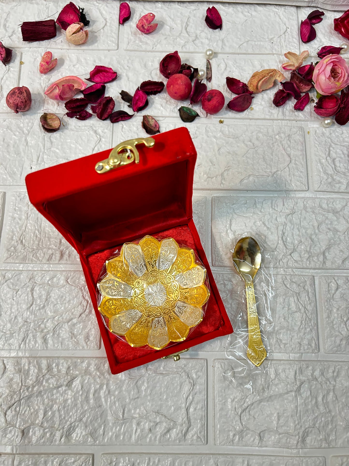 DesiTohfa gold-bowl-spoon-set in a red velvet box with decorative floral background