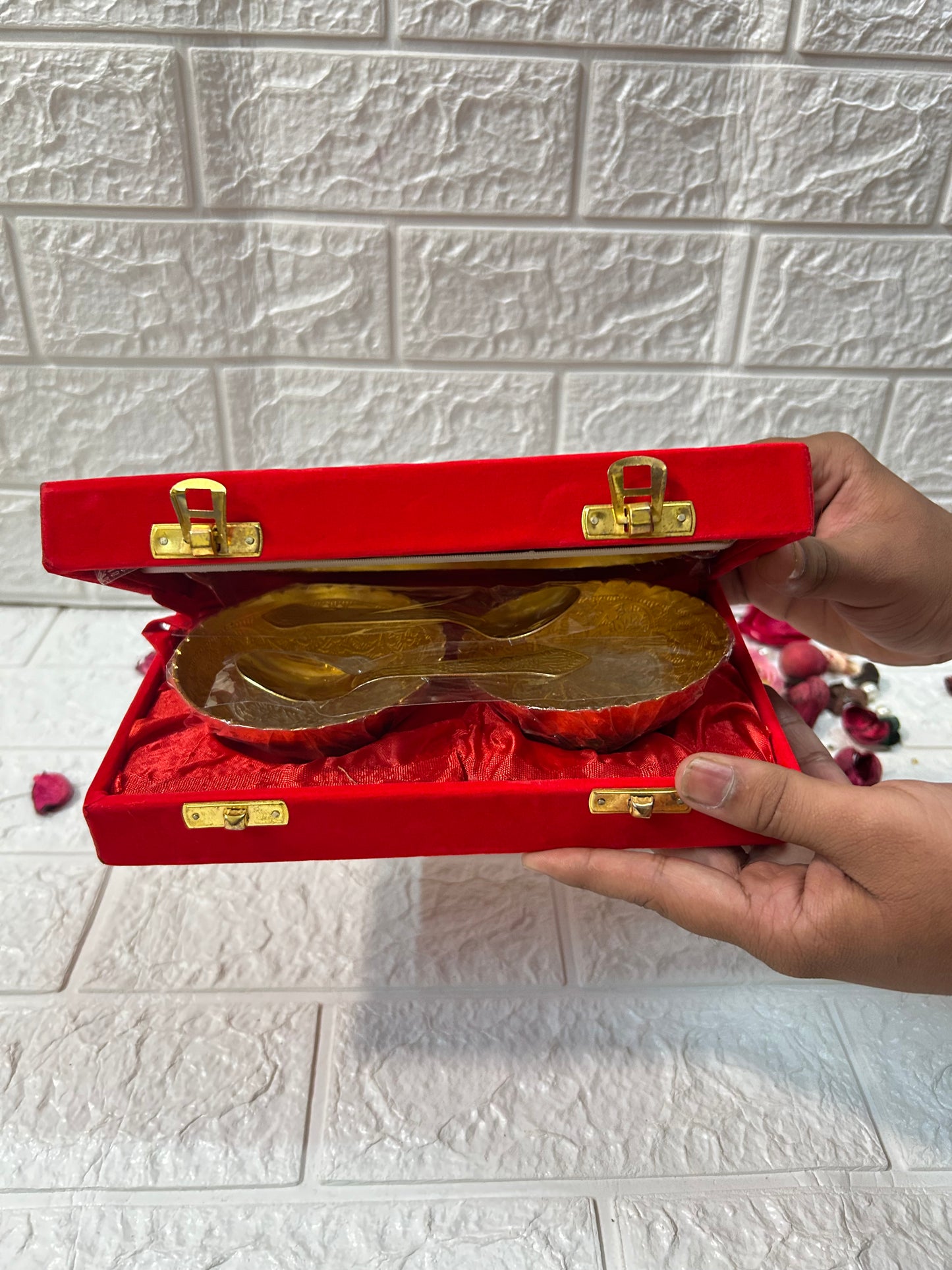 DesiTohfa Gold & Silver Plated Bowl Spoon & Tray Set Wedding Favors Gifts For Guests in red box held by hands