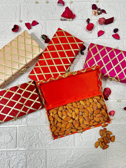 DesiTohfa decorative Shagun Boxes in gold red and pink with almonds inside one open box