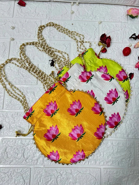 DesiTohfa colorful Potli Bags with lotus flower prints and golden chain handles in yellow white and green
