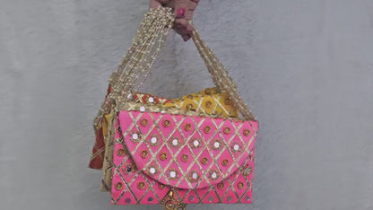 Add a vibrant ethnic touch to your celebrations with this Mirror Work Clutch, perfect for Mehendi & Sangeet return gifts. Stylish, handcrafted, and ideal for weddings, bridesmaid favors, and festive gifting.