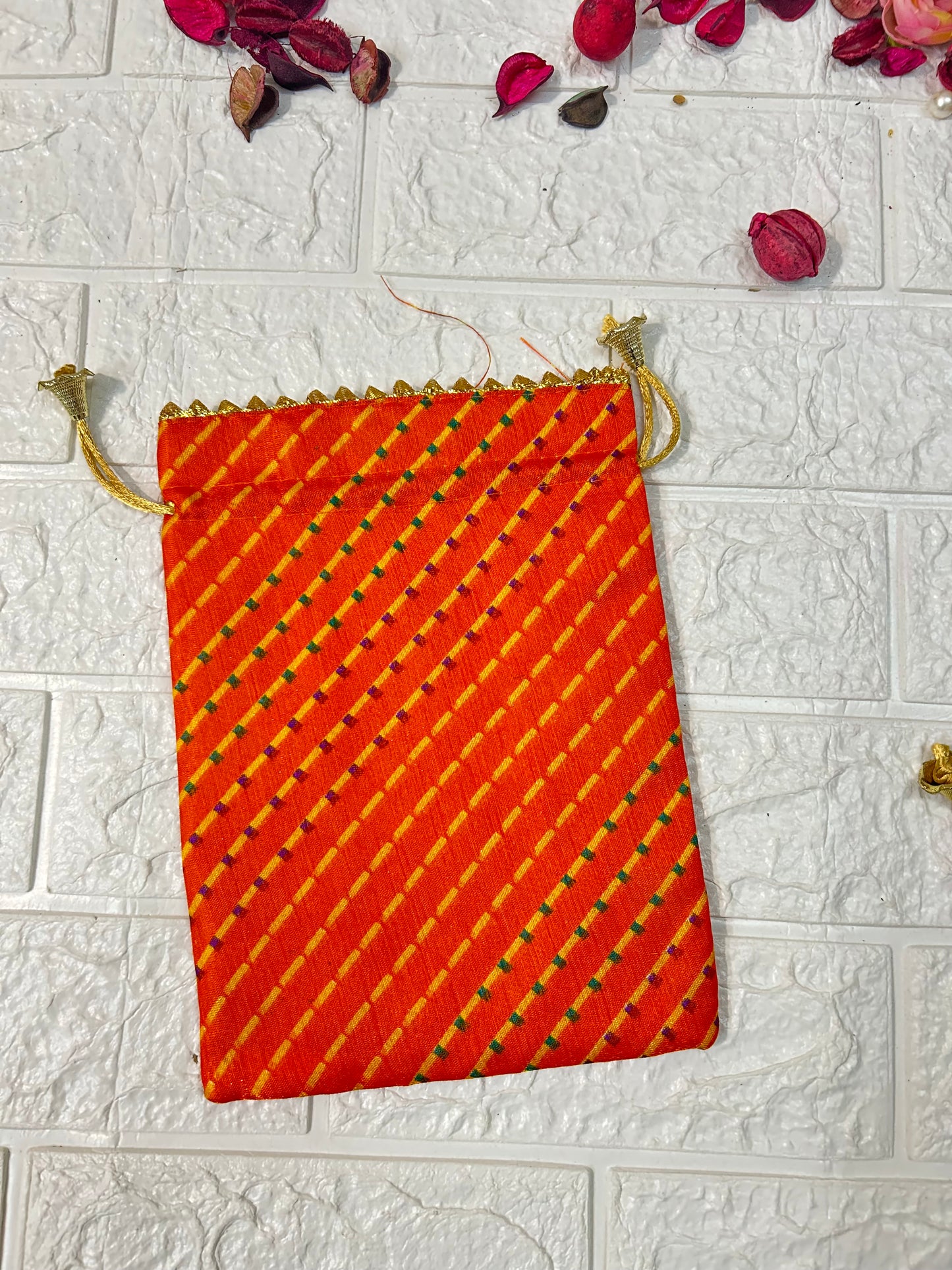 DesiTohfa multicolor Leheriya gift bags with orange and yellow diagonal stripes potli bag