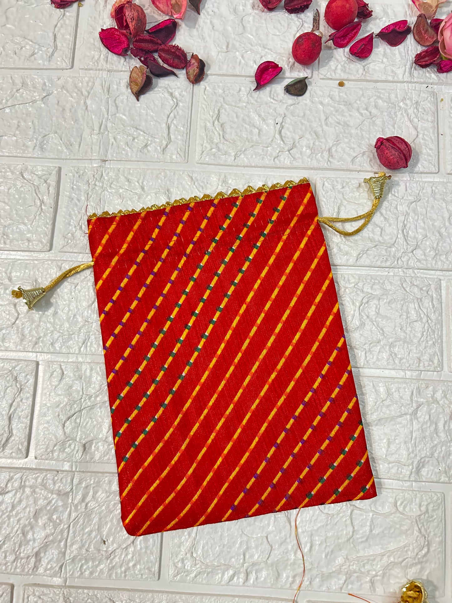 DesiTohfa multicolor leheriya gift bags with red and yellow diagonal stripes and drawstring closure