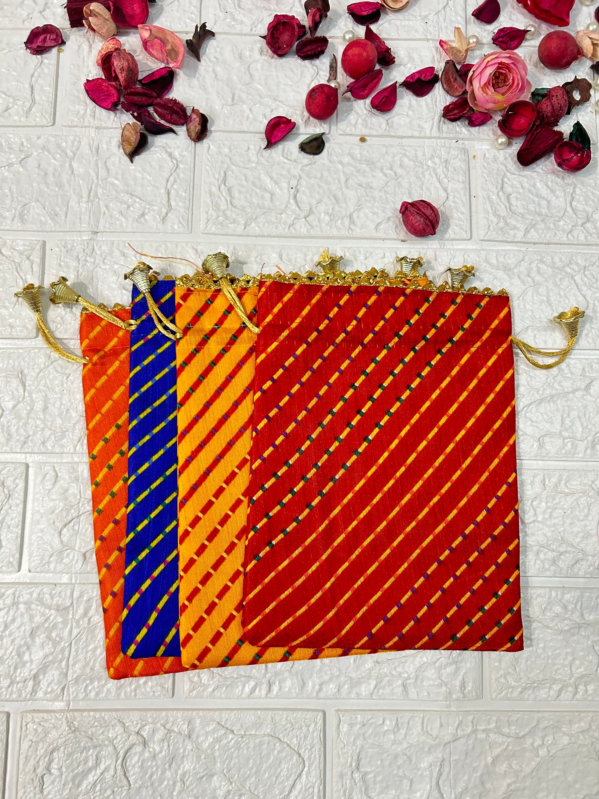 DesiTohfa multicolor Leheriya gift bags with diagonal striped design and golden drawstrings