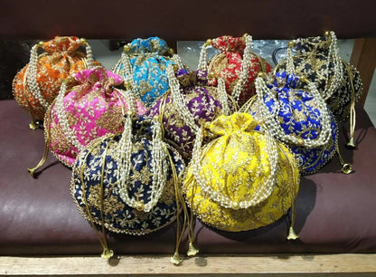 Colorful embroidered potli bags with pearl handles by DesiTohfa perfect for potli-bags-return-gifts