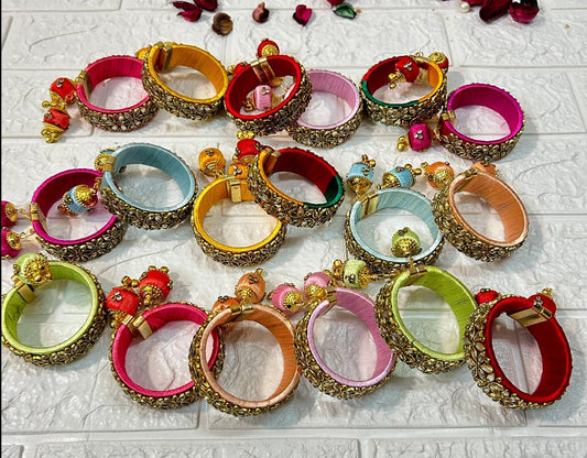 Colorful DesiTohfa Silk Thread openable Bangles adorned with intricate gold detailing and decorative beads