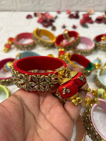 DesiTohfa Silk Thread openable Bangles in red with gold floral design and decorative tassels
